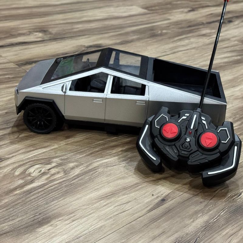 A silver and black remote control toy truck 