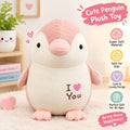 A cute pink and cream plush penguin toy 